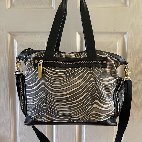 - Tory Burch Nylon Zebra prints & black leather Weekender bag with shoul… - Picture 14 of 15